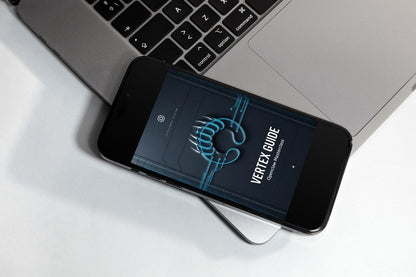 A smartphone on a small display stand showing the 'VERTEX GUIDE' logo on its screen, set against a dark gray textured background.